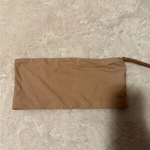 Tan SKIMS strapless bra